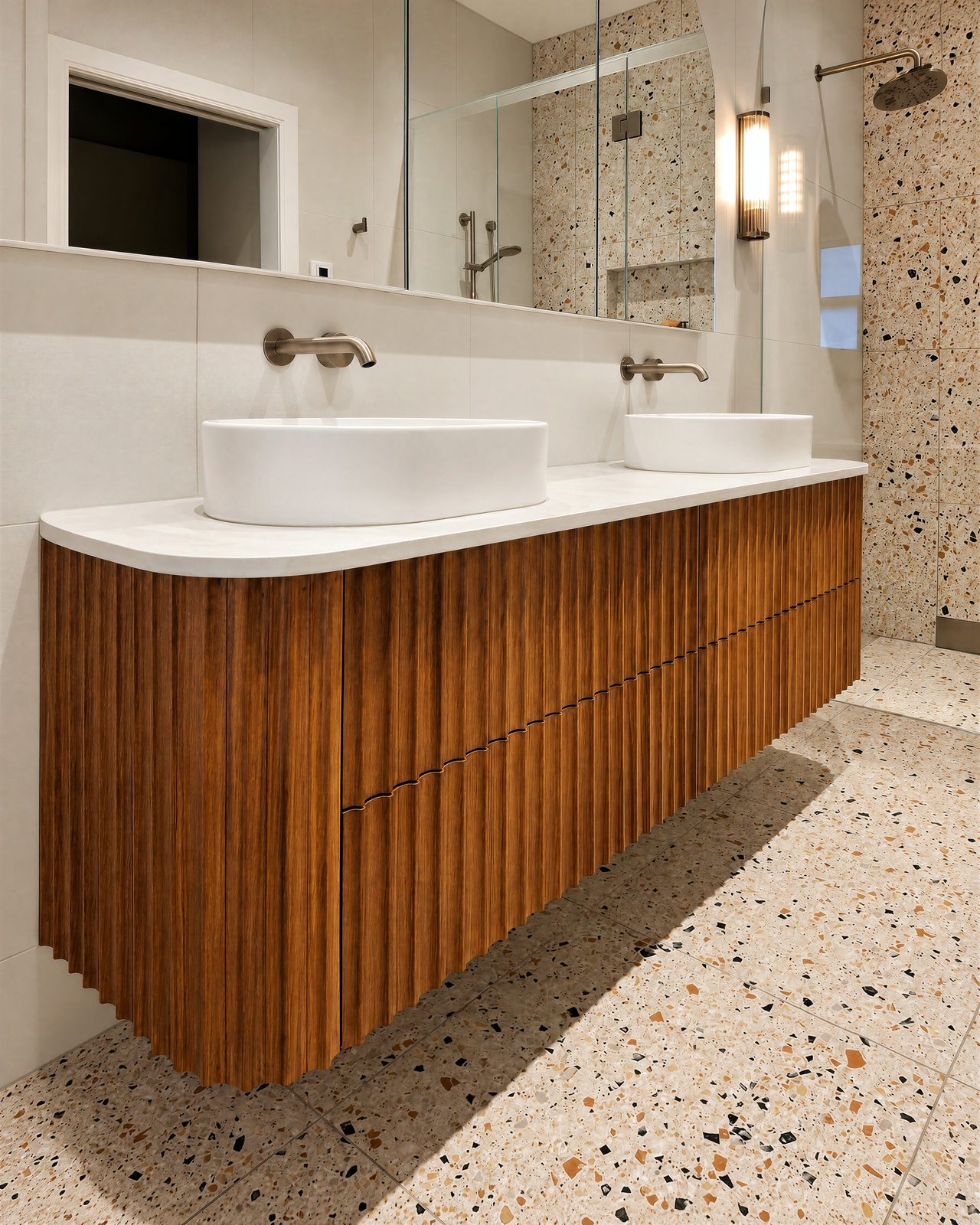 Curved timber vanity with fluted fronts and twin basins