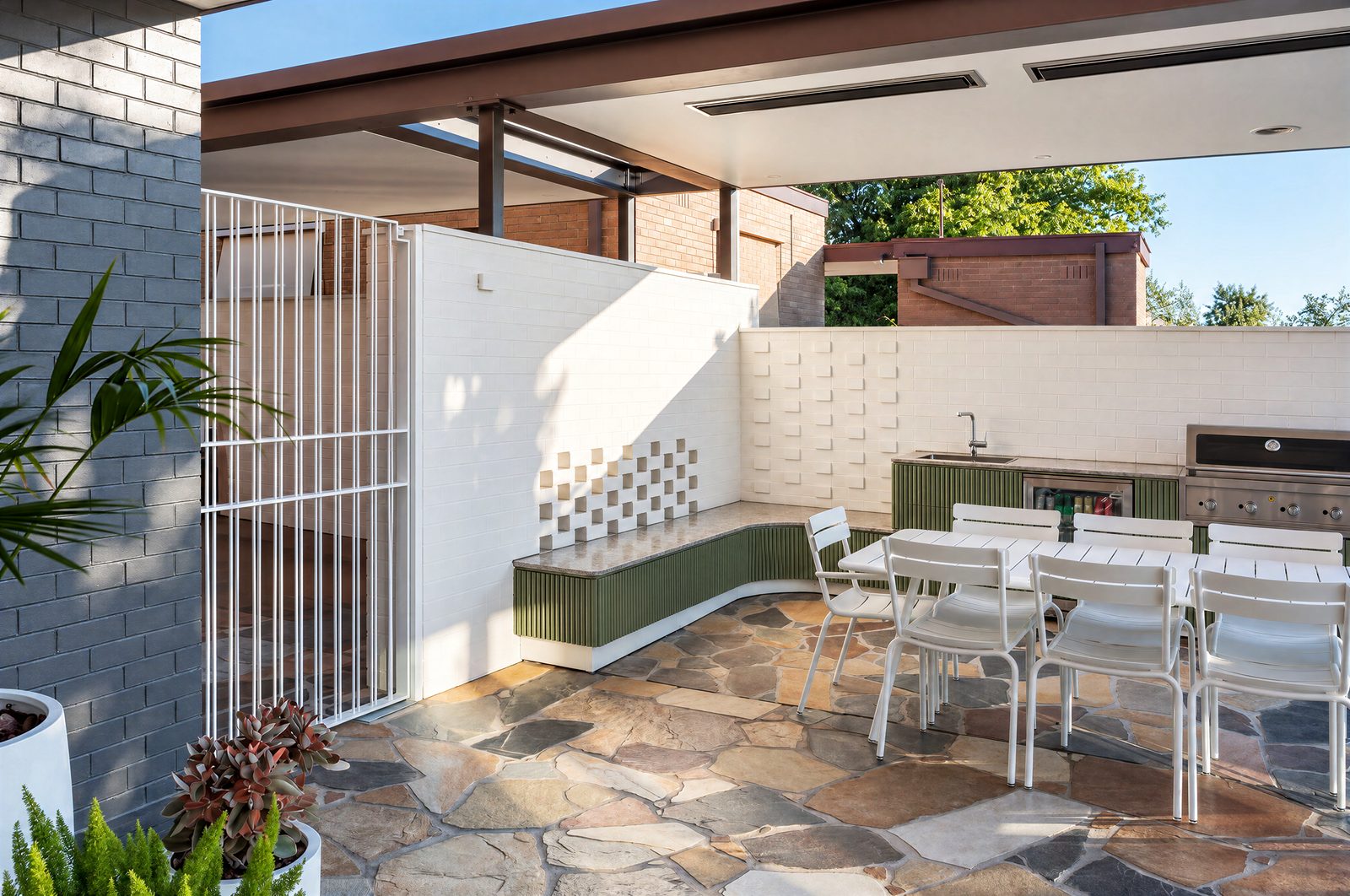 Outdoor kitchen and curved bench seat